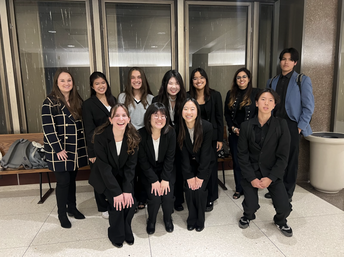 Members of the Mock Trial club gather to celebrate after their inaugural tournament season on Tuesday, Nov. 19, inside the Superior Court of California, County of Orange.